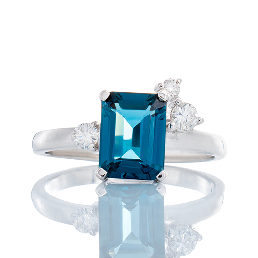 2.00ct Emerald Cut London Blue Topaz with 0.15ctw Three Offset Diamond Accents Ring