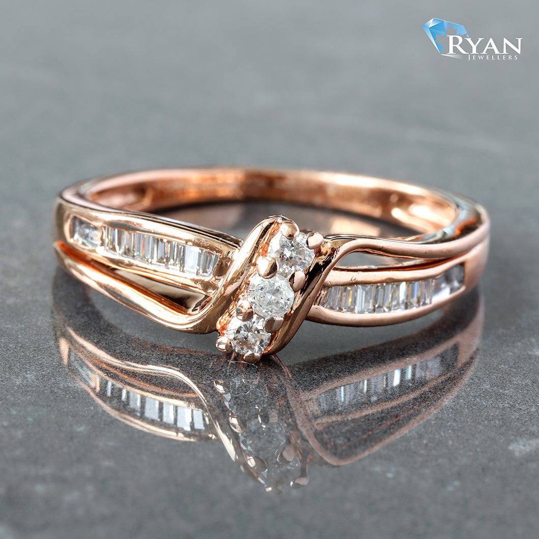 RING GR 10K 0.15CTW DIAMOND THREE STONE BAGUETTE CHANNEL CROSS OVER DESIGN