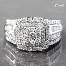 Load image into Gallery viewer, RING GW 10K 1.00CTW IMPERIAL CUSHION CLUSTER WITH DOUBLE HALO FOUR ROW CHANNEL AND PRONG SET SHOULDERS
