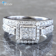 Load image into Gallery viewer, RING GW 10K 1.10CTW INVISIBLE PRINCESS QUAD CENTER WITH SQUARE HALO SIDE STONE ACCENT WITH MILLEDGE DIAMOND SHOULDERS AND BAND
