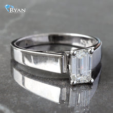 Load image into Gallery viewer, RING GW 14KT 0.65CT EMERALD CUT SOLITAIRE HP UPSWEPT FLAT EDGE SHOULDERS
