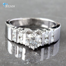 Load image into Gallery viewer, RING GW 18K 0.88CTW ROUND 6 PRONG SOLITAIRE SECTIONAL CHANNEL SET SHOULDERS
