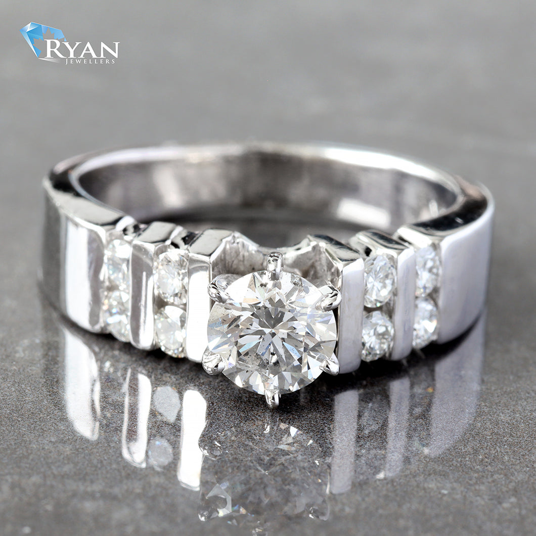 RING GW 18K 0.88CTW ROUND 6 PRONG SOLITAIRE SECTIONAL CHANNEL SET SHOULDERS