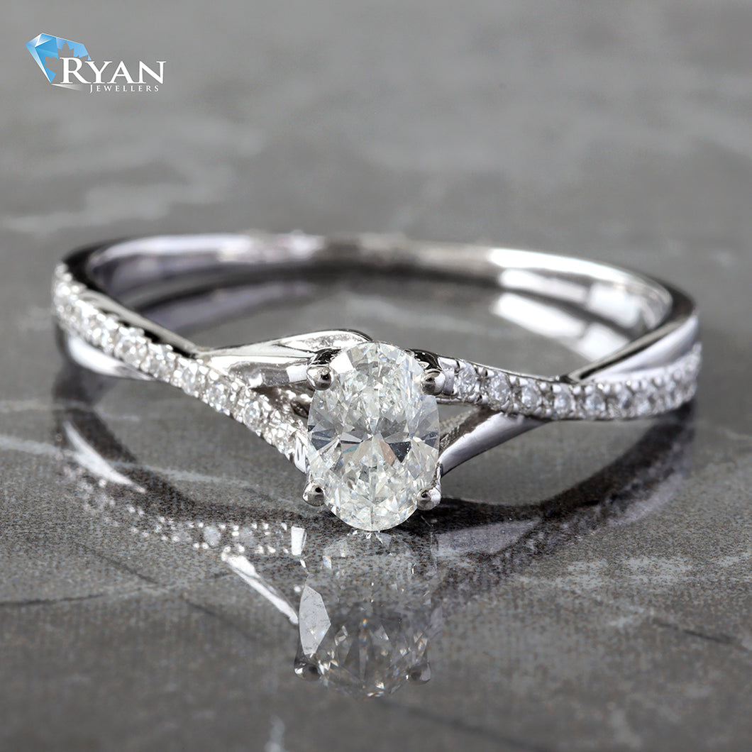 0.52CTW Oval Center with High Polished Diamond Pave Criss Cross Ring