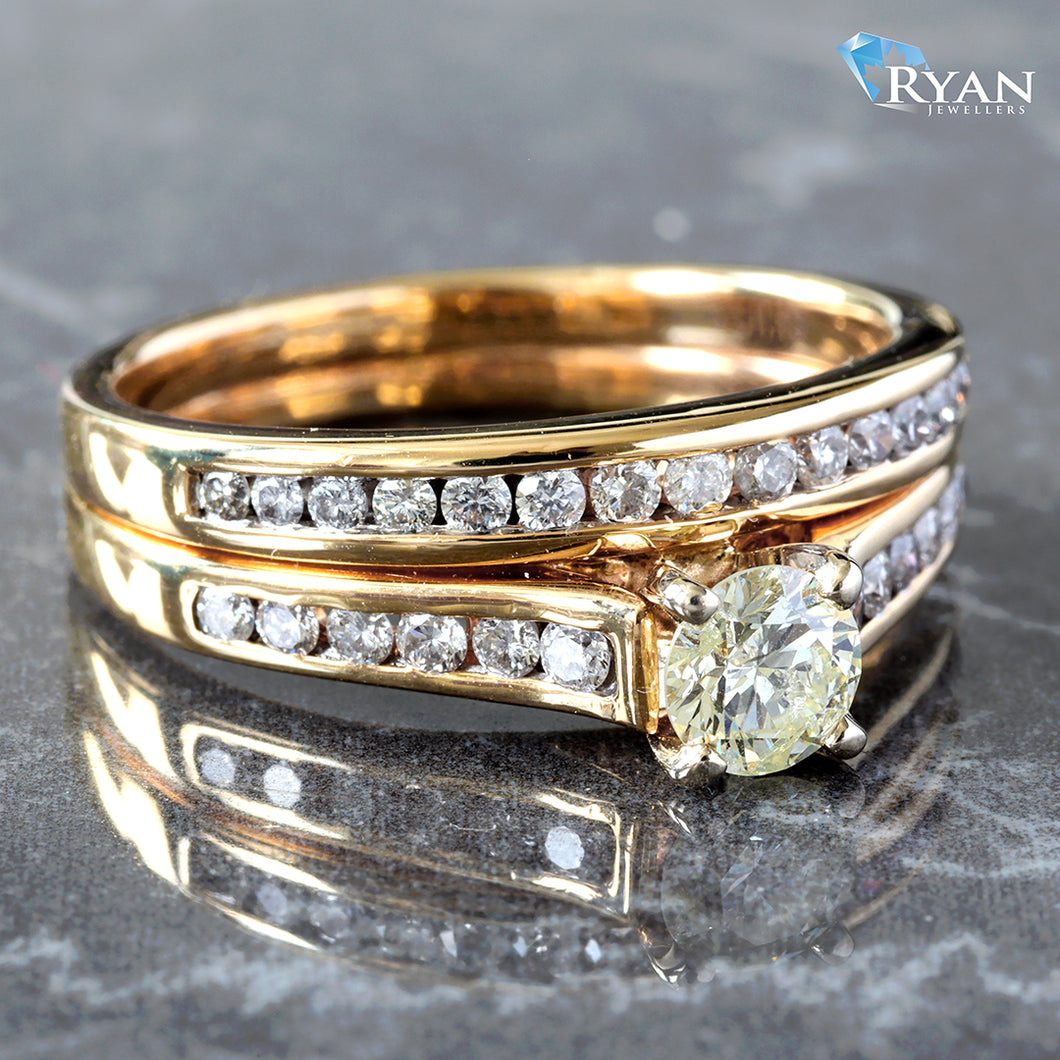 RING GY 14K 0.85CTW ROUND SOLITAIRE WITH CHANNEL SET SHOULDERS AND SOLDERED BAND