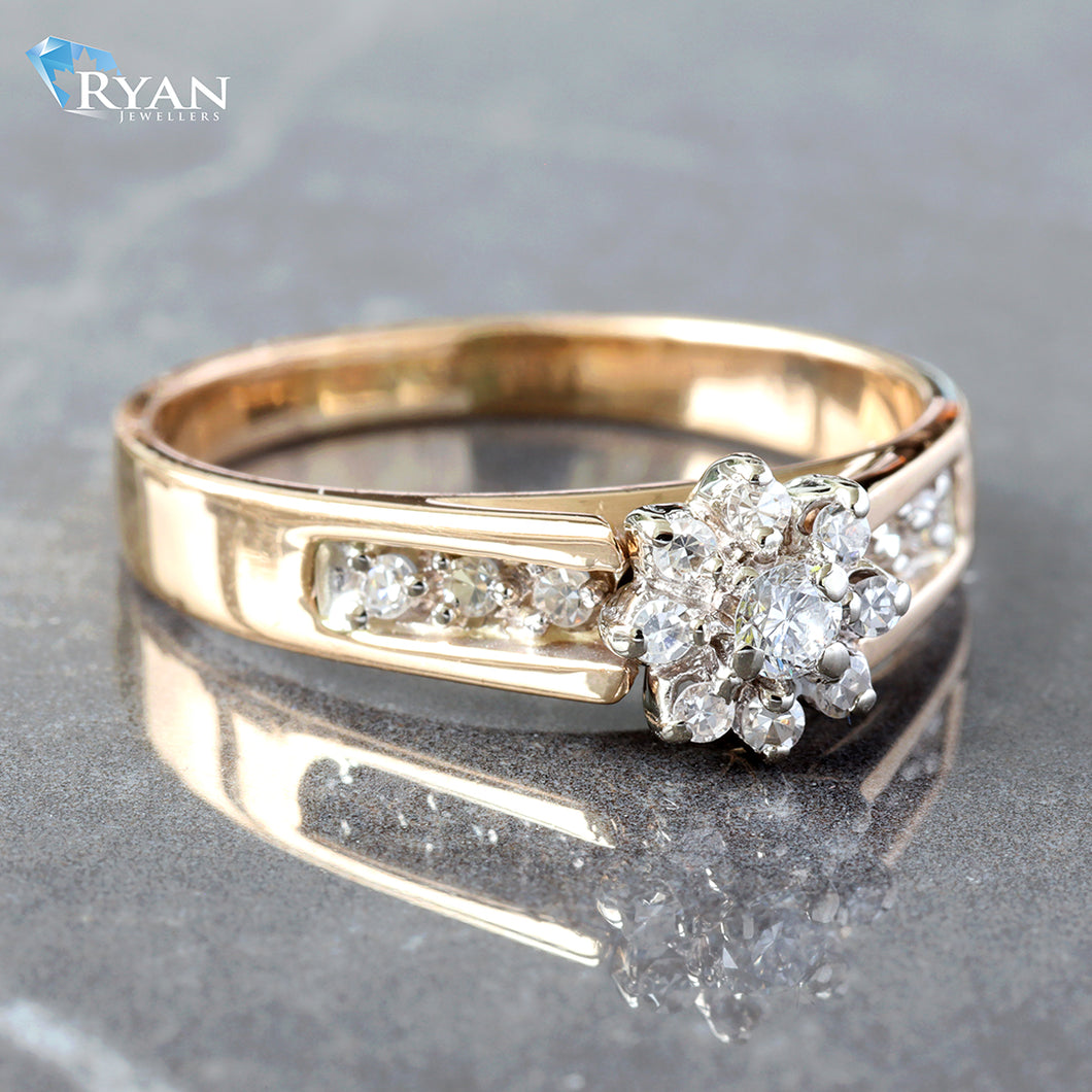 RING GY 10K 0.20CTW FLOWER CLUSTER CENTER WITH UPSWEPT PAVE CHANNEL SHOULDERS