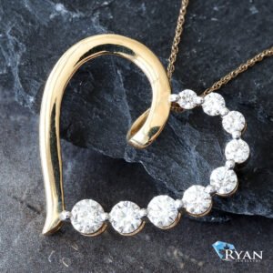 1.00ctw Open Heart with Single  Round Diamond Graduated and One Side High Polished Pendant
