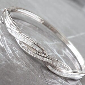 1.00CTW ROUND AND BAGUETTE CHANNEL SET DIAMOND CROSS OVER OPEN HINGED BANGLE