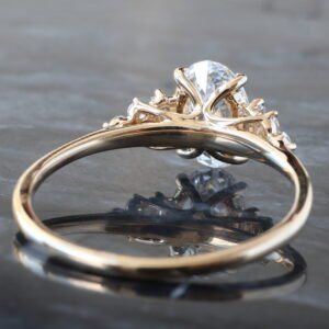 1.15ctw Oval Diamond Center with Baguette Shoulders and Fluer De Lis Cluster Accents Ring 14K Yellow Gold