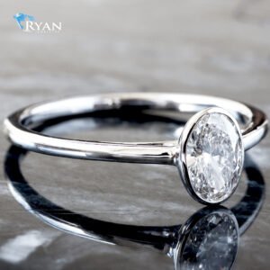 0.50ctw Oval Diamond Solitaire Set in A Bezel Setting High Polished Shoulders Ring 14K White Gold