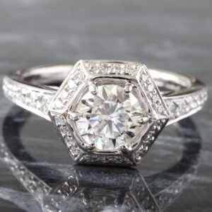 LAB RING GW 18K 1.35CTW ROUND BRILLIANT CENTER WITH ART DECO HEXAGONAL HALO AND GRADUATING SHARED PRONG CHANNEL UPSWEPT SHOUDLERS